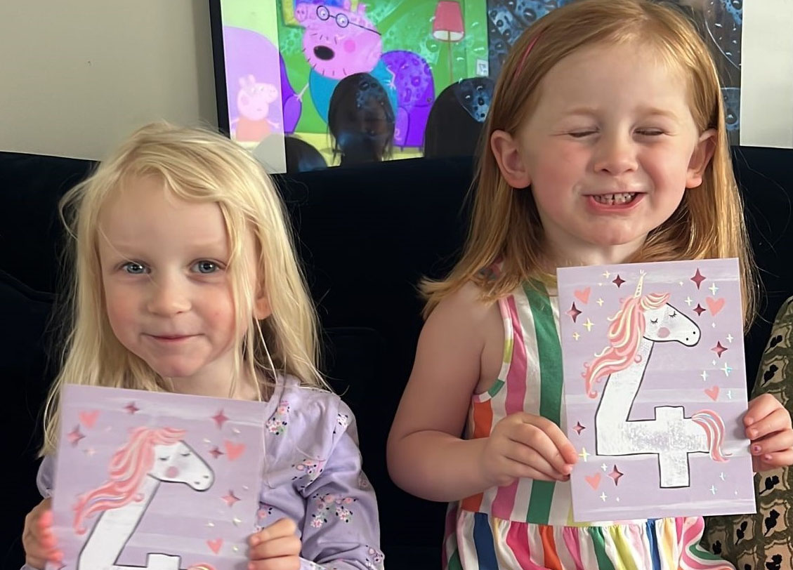 Sophia and Rose with their fourth birthday cards.